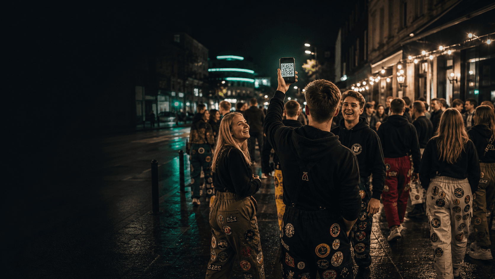Students in overalls moving between venues with a QR code at night.